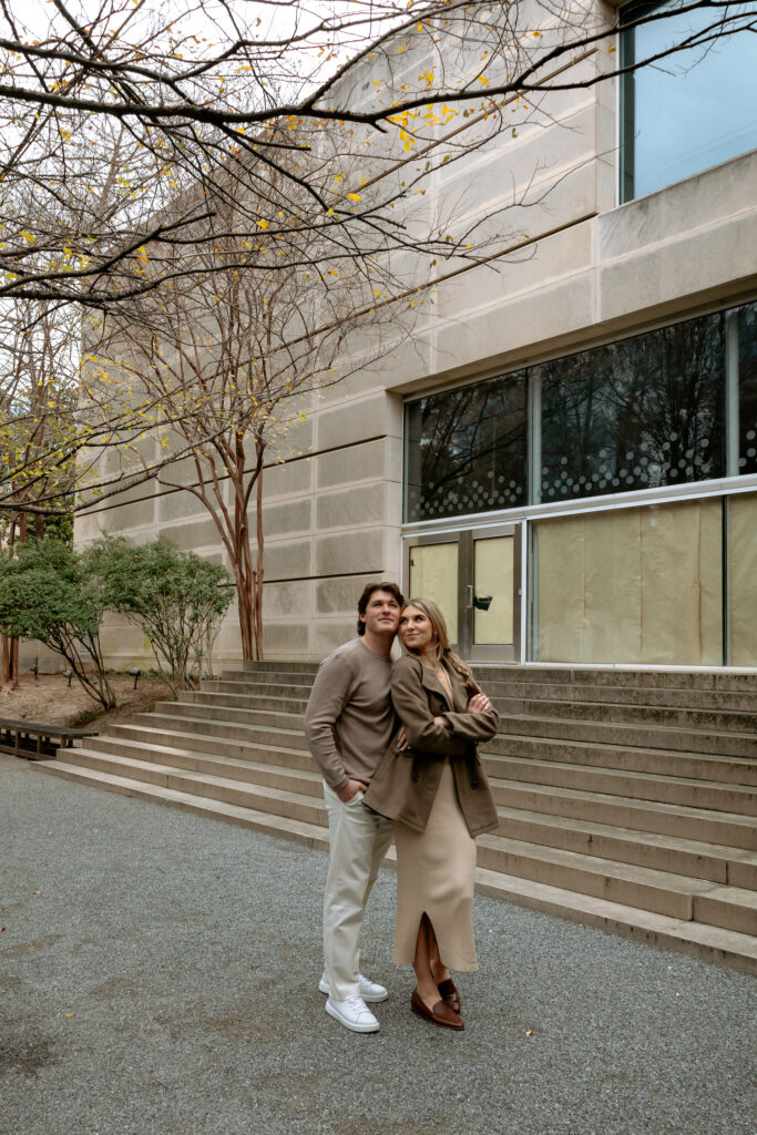 Engagement photo of couple outside of art museum