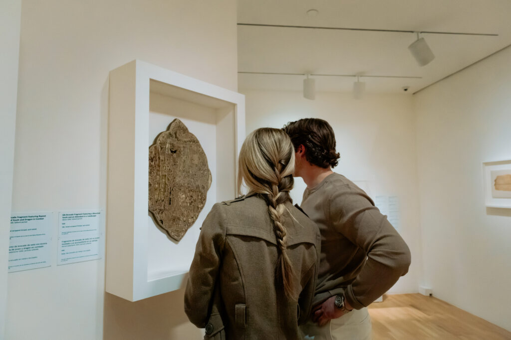 Photo of a couple at a Dallas museum admiring the artwork