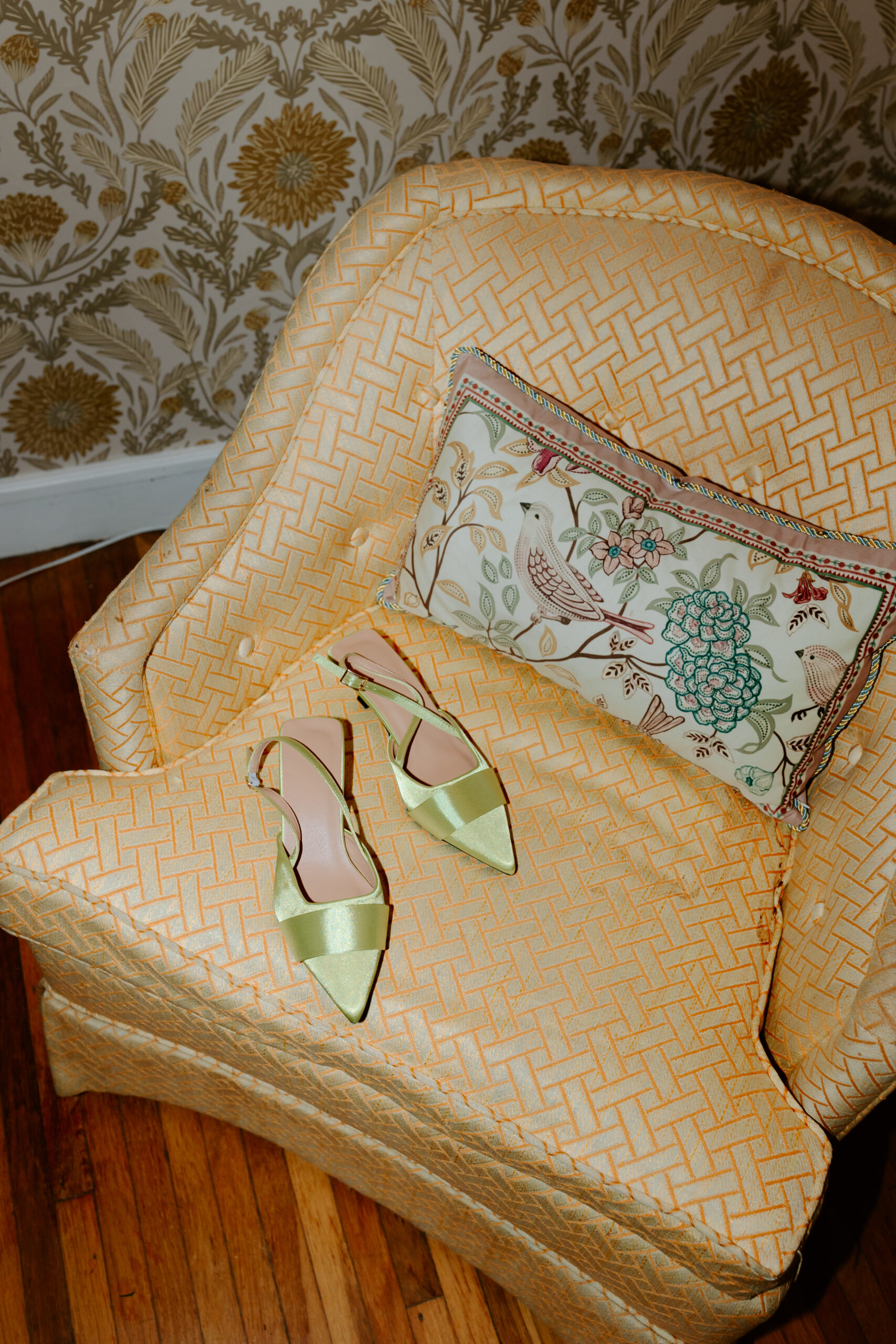 Vintage yellow chair and green wedding shoes photograph